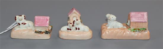 Three Staffordshire porcelain toy figures of spaniels or a poodle with a kennel, c.1830-50, W. 5.2cm-7.3cm